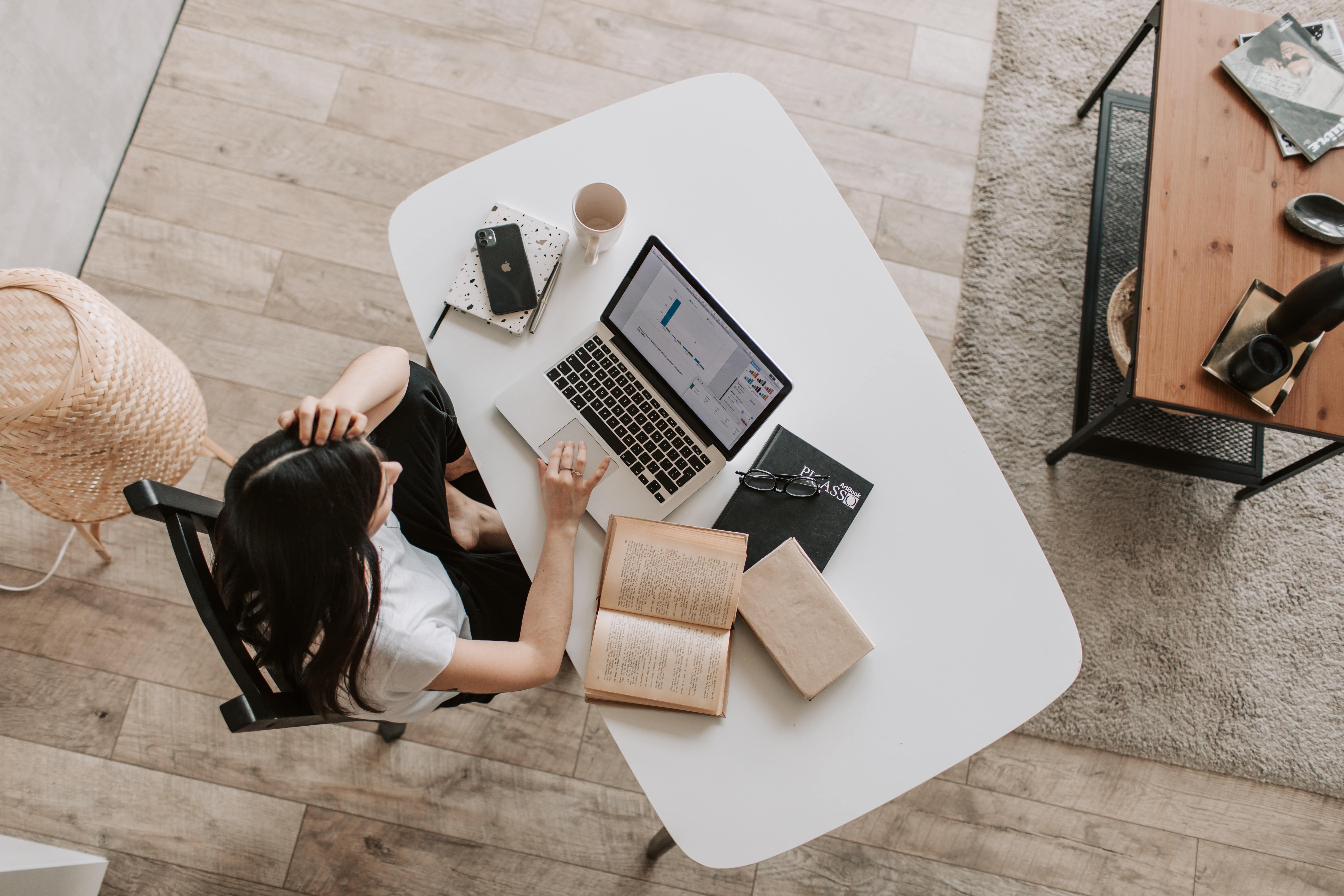 Woman working at a desk as seen from above