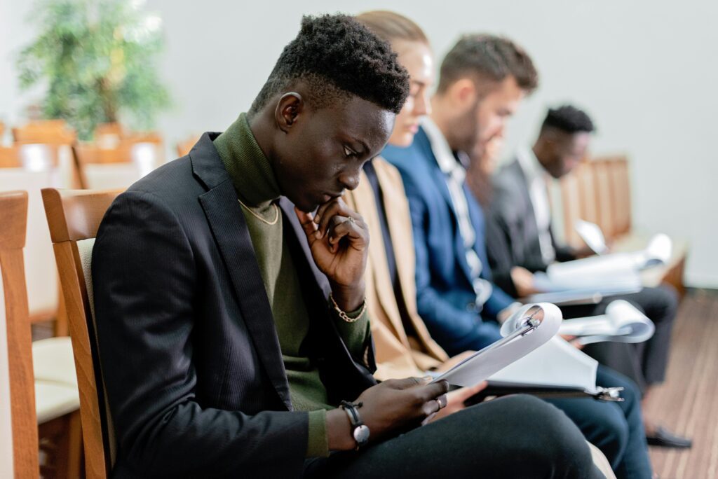 Students attending a property insurance training class, learning about underwriting, claims handling, and policy regulations in a professional setting.